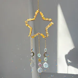 Macro view of star sun catcher with citrine stones and rainbow prism reflections.