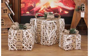 Decorative set of three white woven LED Christmas gift boxes with festive burlap ribbons