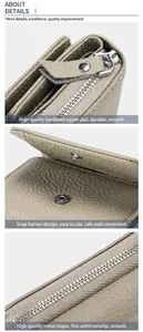 Detaillierte Nahaufnahme von hochwertigem Metall-Reißverschluss und Druckknopf aus Leder