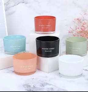 Detailed view of colorful minimalist scented candle glass jars for elegant home decor