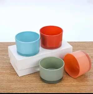 Set of four colorful glass candle holders for aromatherapy and decorative display