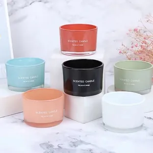 Set of six colorful frosted glass scented candle jars in a minimalist modern style