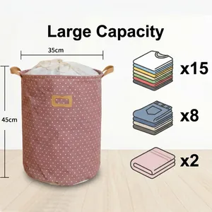 Collapsible linen laundry basket with drawstring closure and pink polka dot pattern