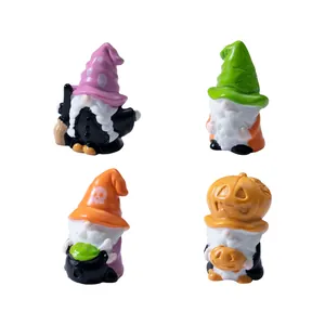 Set of four Halloween gnome figurines featuring witch and pumpkin designs for desk decor