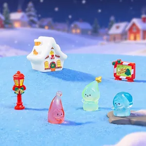 Miniature Christmas landscape set with snowy cabin, street lamp and cute jelly elves