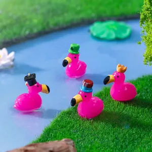 Set of miniature pink flamingo figurines with various hats for DIY micro landscape