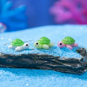 Three cute mini resin turtles on blue sand for aquarium and micro landscape DIY decor