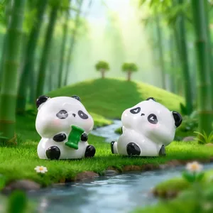 Two adorable panda figurines holding bamboo for DIY miniature desktop garden decor