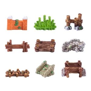 Miniature garden ornaments including wooden fences, stone bridges, and bamboo