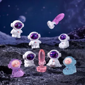 Creative mini astronaut and rocket figurines for space-themed DIY landscaping decorations