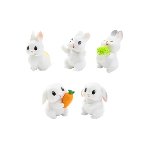 Juego de 5 lindas figuras de conejitos blancos con zanahoria y col para decoración jardín.