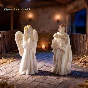 Detailed resin miniature figurines of an angel and shepherd for nativity scene decor