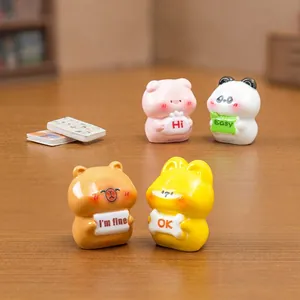 Set of four cute cartoon resin animal figurines holding signs for DIY dollhouse decor