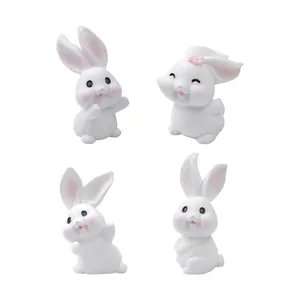 Set di quattro graziose statuette di coniglietti bianchi per decorazione casa