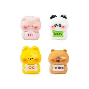 Set of four cute cartoon animal figurines holding signs for micro landscape DIY decor