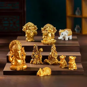 Handcrafted golden Ganesha and Hanuman deity figurines for car and home desktop decor.
