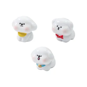Set di tre figurine di cuccioli in miniatura con fiocchi per decorazione micro paesaggi
