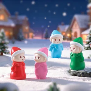 Set of colorful cute doll figurines in a winter snow landscape micro-decoration
