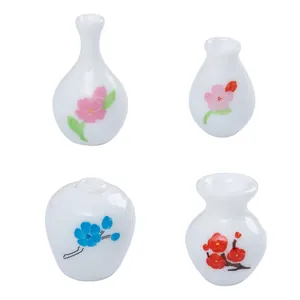 Set of four miniature white ceramic flower vases with patterns for dollhouse DIY decor