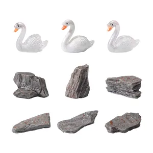 Miniature white glitter swan figurines and rock stones for micro-landscape garden decor