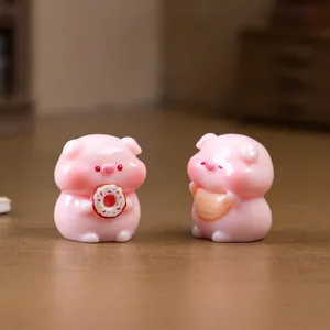 Two cute miniature pink pig figurines with donut for DIY micro landscape dollhouse