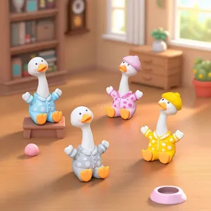 Adorable nodding duck figurines wearing polka-dot pajamas for desktop and car decoration