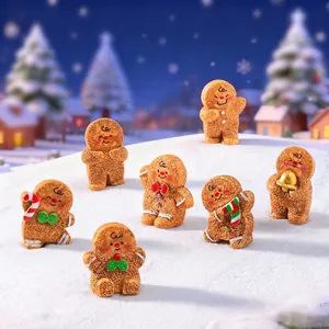 Set of cute Christmas gingerbread man figurines displayed in a miniature snowy winter landscape