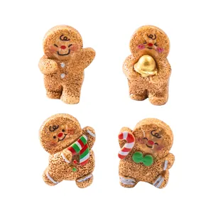 Set of four cute miniature Christmas gingerbread man figures for DIY micro landscape