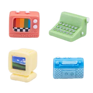 Set of 4 retro miniature appliances including tiny TV, computer, typewriter, and radio