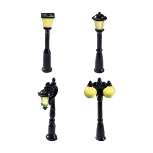 Four miniature vintage street lamps for DIY fairy garden and terrarium decoration.