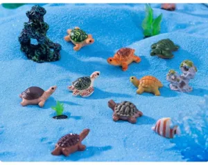 Detailed view of colorful miniature sea turtle figurines for aquarium micro landscape.