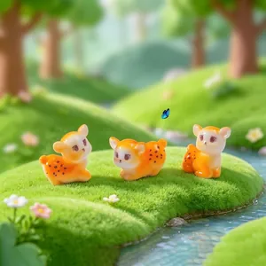 Set aus drei niedlichen Miniatur-Hirschfiguren in Orange für Garten und Schreibtisch