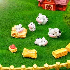 Adorable miniature cow figurines set for DIY farm landscape decoration on green grass