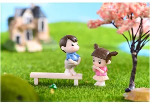 Detail view of cute miniature resin couple figurines for DIY moss landscape decor