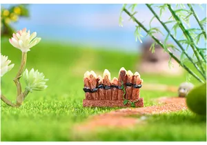 Close-up of miniature resin fence with vine detail for terrarium DIY landscaping