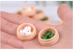 Detailed macro shot of miniature resin dim sum and steamed buns in tiny steamers