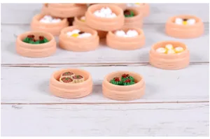 Detailed macro view of miniature resin dim sum steamers for dollhouse and desk decoration