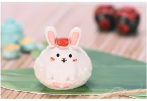 Close-up of a cute bunny zongzi resin figurine for micro landscape decor.