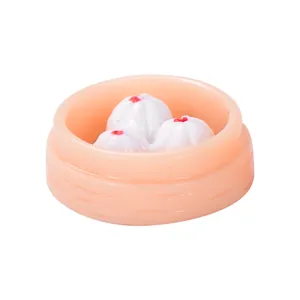 Miniature resin xiaolongbao steamed bun ornament for micro landscapes and dollhouses.