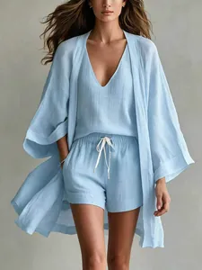Full view of a women's light blue casual 3-piece set with cardigan, tank, and shorts.
