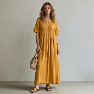 Elegant mustard yellow pleated cotton linen maxi dress featuring V-neck and short sleeves