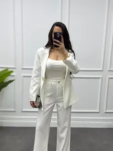 Detail view of elegant white slim-fit blazer suit set for professional women commute