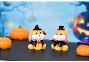 Miniature Halloween figurines featuring cute shiba inu dogs in costumes and pumpkins