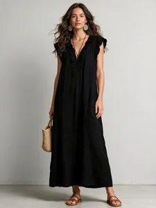 Elegant black bohemian flutter sleeve maxi dress with ruffled V-neckline detail.