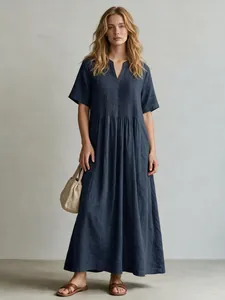 Elegant navy blue cotton linen maxi dress with pleated V-neck details and loose fit