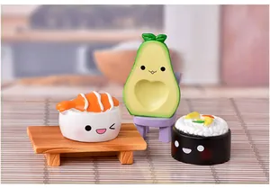 Macro detail of cute avocado and sushi resin miniatures for fairy garden