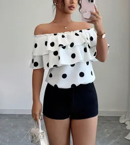 Fashionable off-the-shoulder blouse with polka dots and ruffle layers for summer look