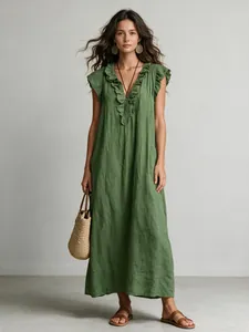 Elegant bohemian style green maxi dress with ruffled flutter sleeves on a model
