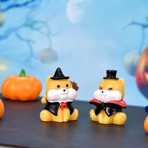 Pair of Halloween miniature Shiba Inu figurines in witch and vampire costumes for decor