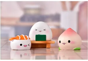 Close-up of cute resin sushi, onigiri and peach figurines for micro landscapes